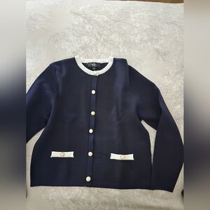 Classic Navy Knit Jacket with White Trim and Pearl Buttons